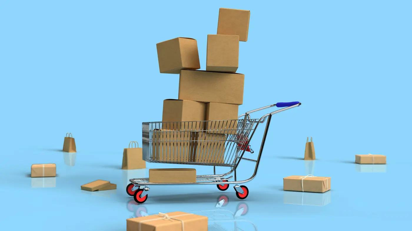 Shopping cart loaded with parcels on a blue background