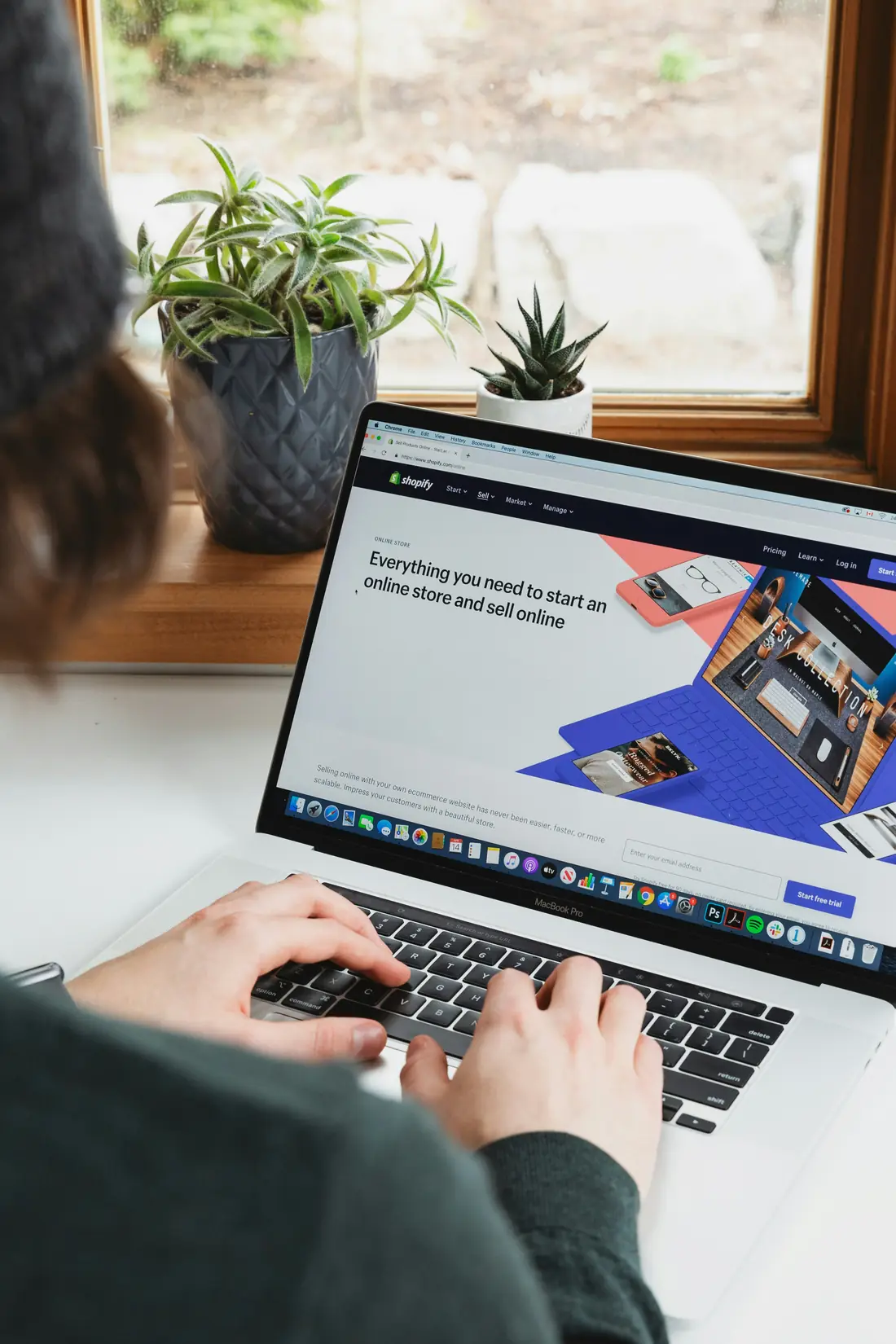 Person building an online store on a laptop