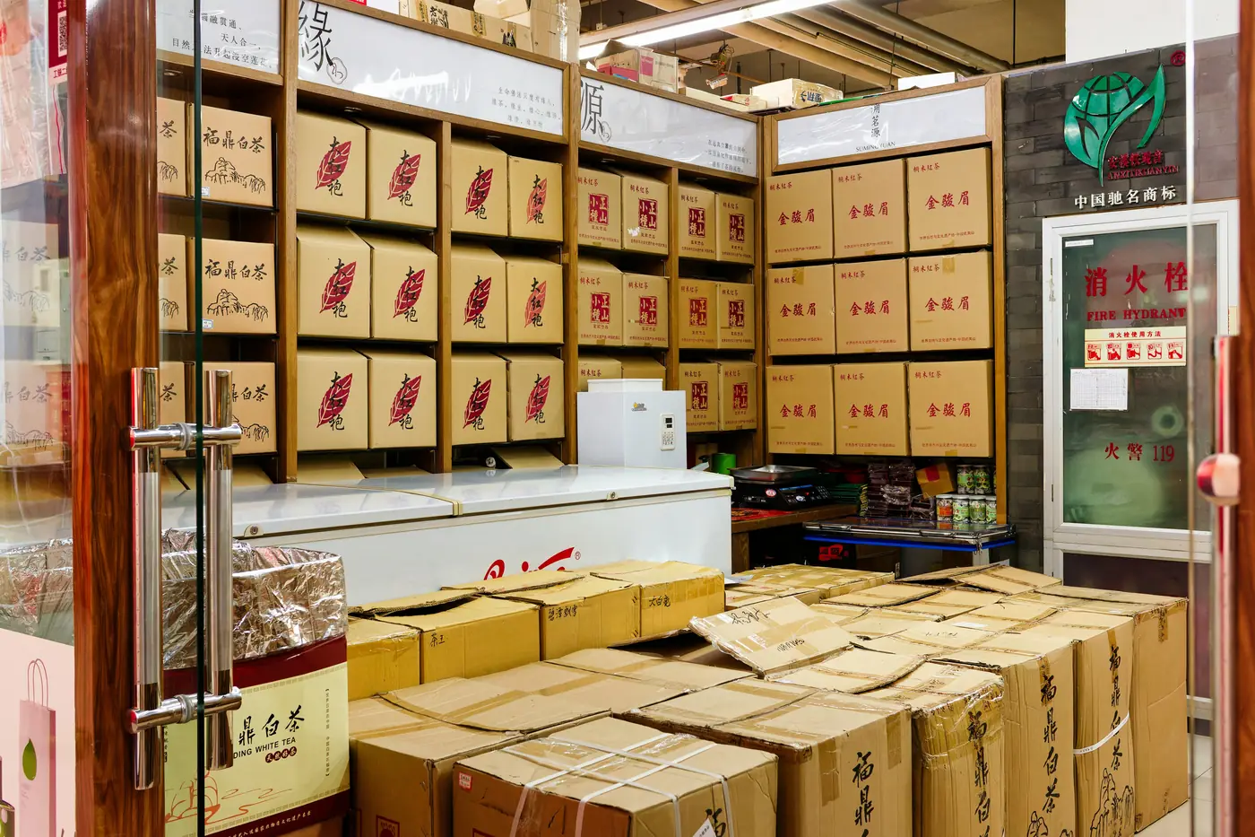 Shelves of packed cartons in a small seller storeroom